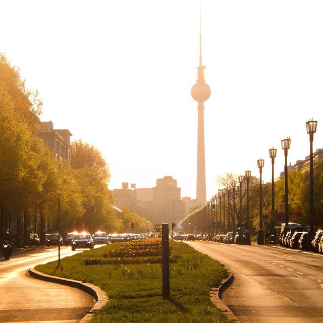 View of the Fernsehturm Berlin TV tower on a sunny day, capturing the city's skyline and urban landscape.