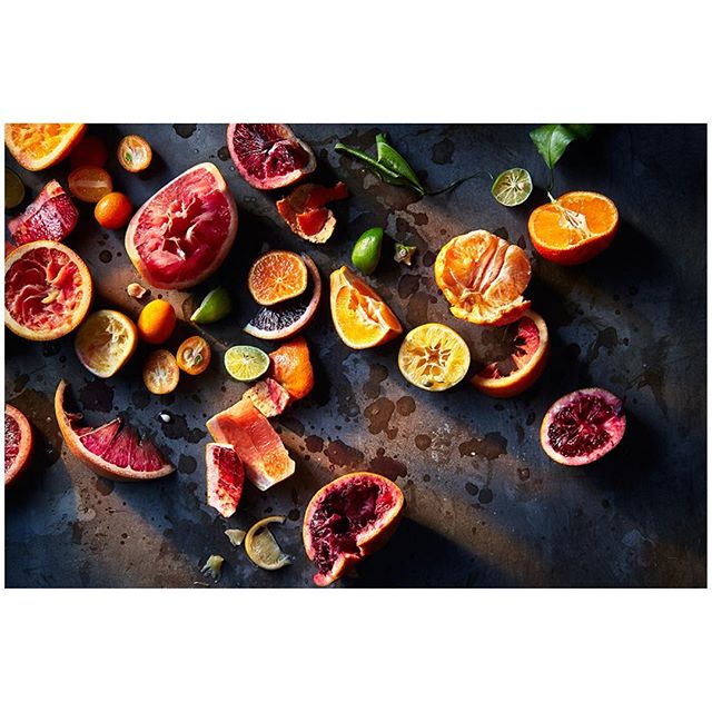 A vibrant still life showcasing a variety of colorful sliced citrus fruits, perfect for healthy eating and fresh recipe ideas.