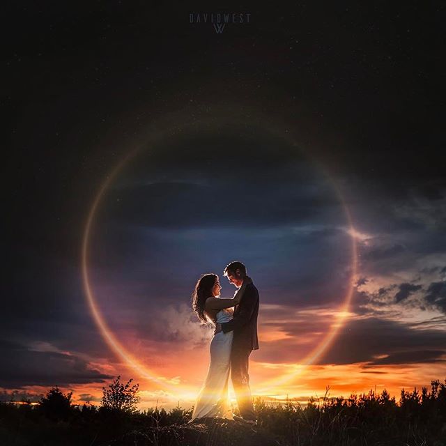 A couple embraces in a romantic sunset silhouette, a symbol of love and new beginnings.