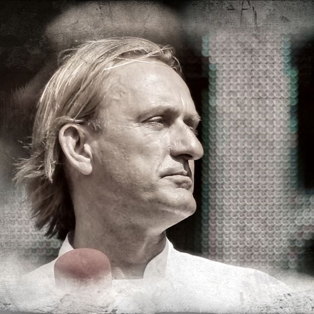 A monochrome portrait of a man looking away, ideal for professional branding and marketing.