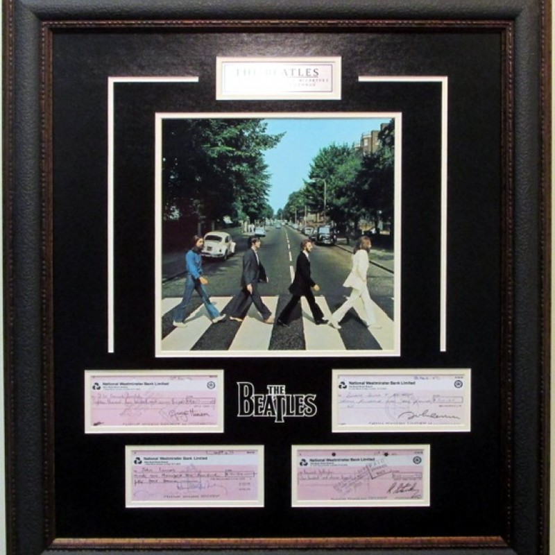 The Beatles Display with Replica Signed Checks from Each Member