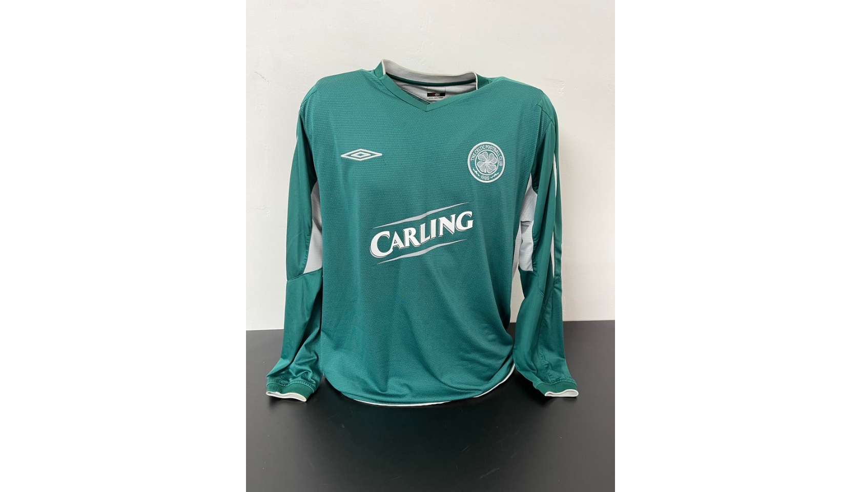 framed signed celtic top