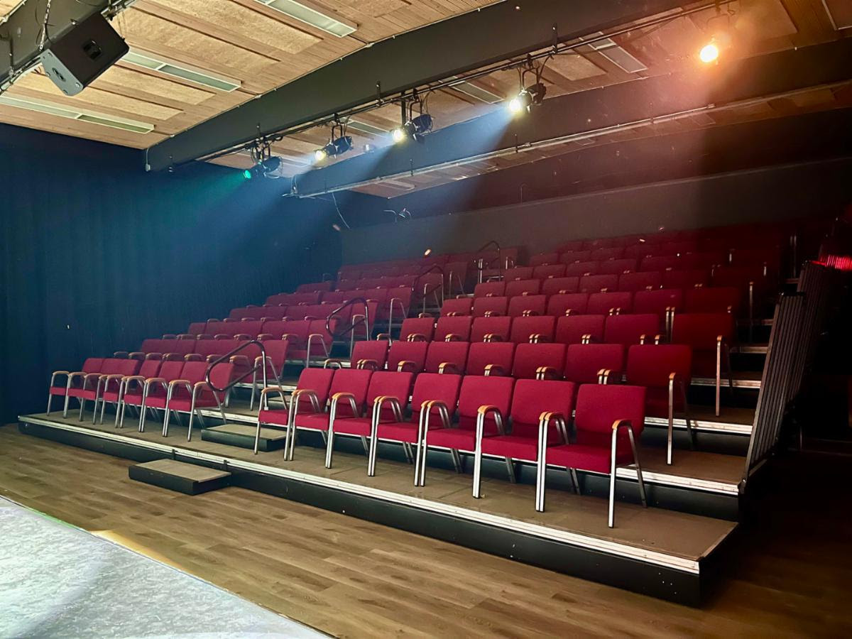 Red chairs in auditorium for Bethesda Writer's Center theater
