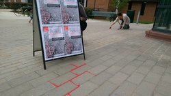 Students take part in the Red Sand Project outside of the Fenwick Library