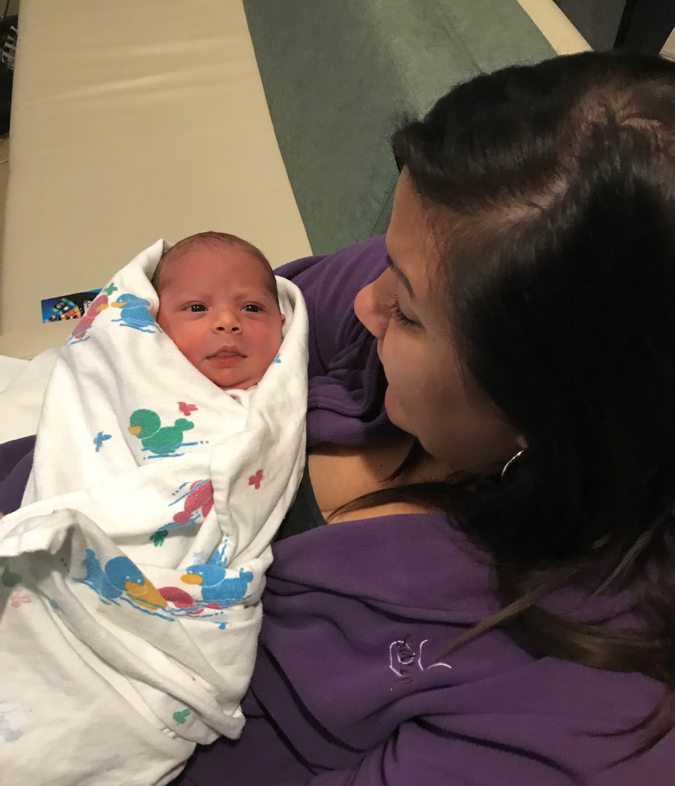 Sarah shares a quiet moment with her third surrobaby.