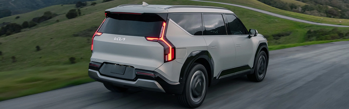 2024 Kia Niro EV vs Kia EV9 white color back view