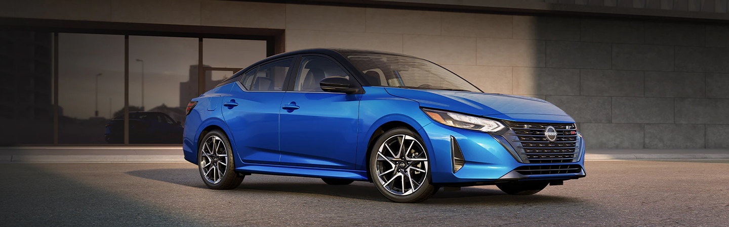 2024 Nissan Sentra vs Nissan Leaf front side in blue