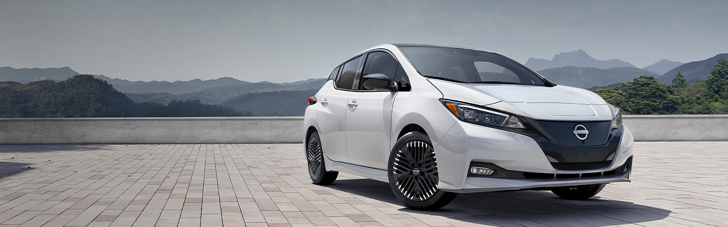 2024 Nissan Sentra vs Nissan Leaf front side in white
