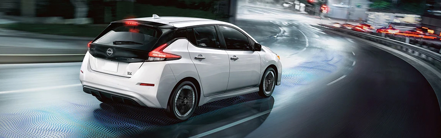 2024 Nissan Sentra vs Nissan Leaf back side in white
