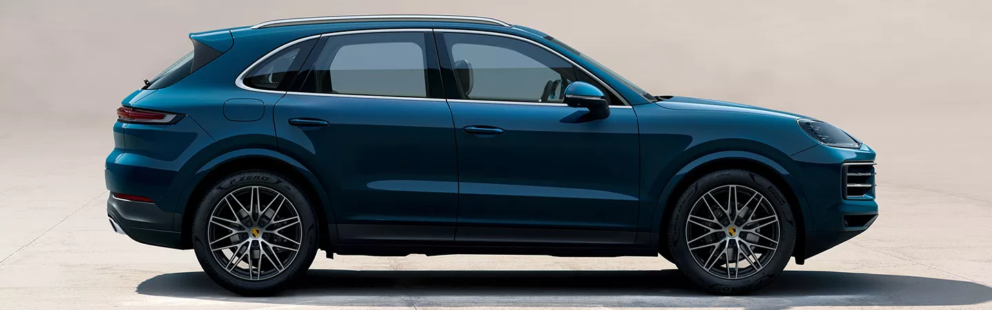 Side view of a 2026 Porsche Cayenne parked in a parking lot