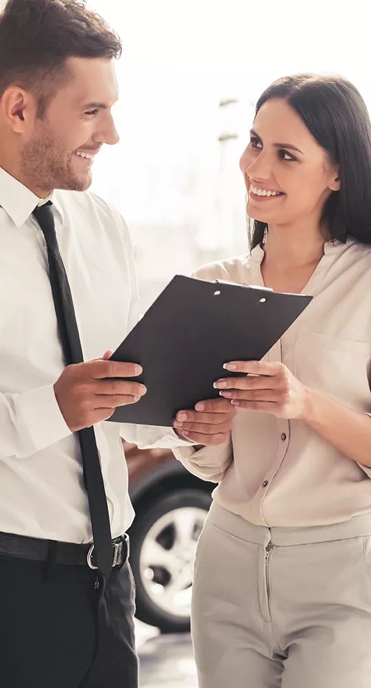Finance manager showing woman the numbers on a tablet