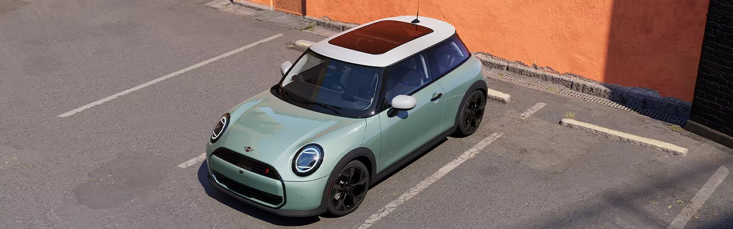 Parked 2026 MINI Cooper 2-Door in front of a building
