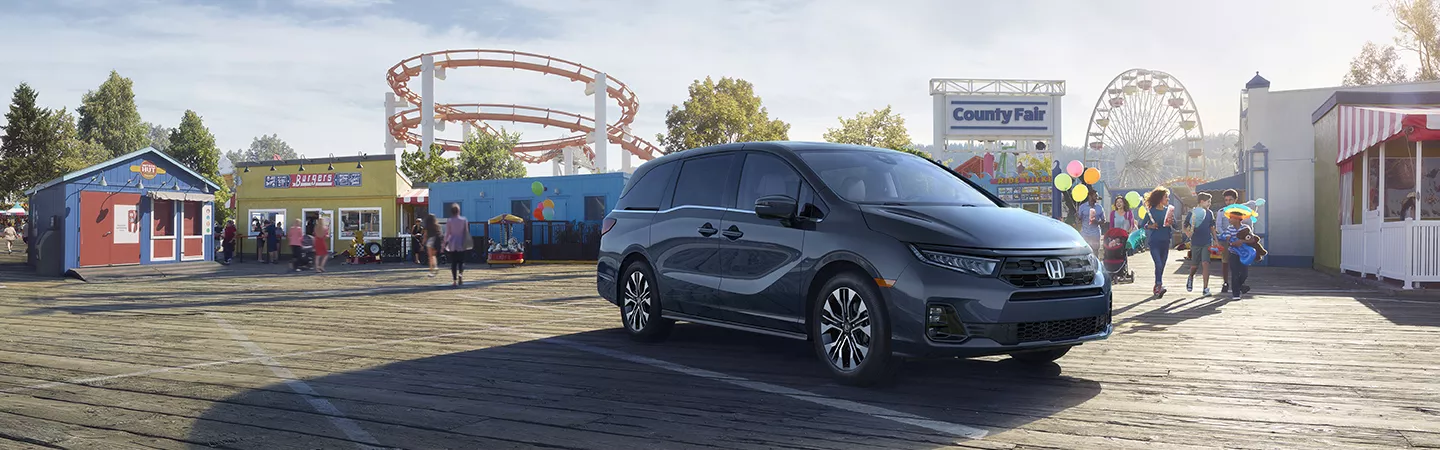 2026 Honda Odyssey parked in the parking lot of the county fair