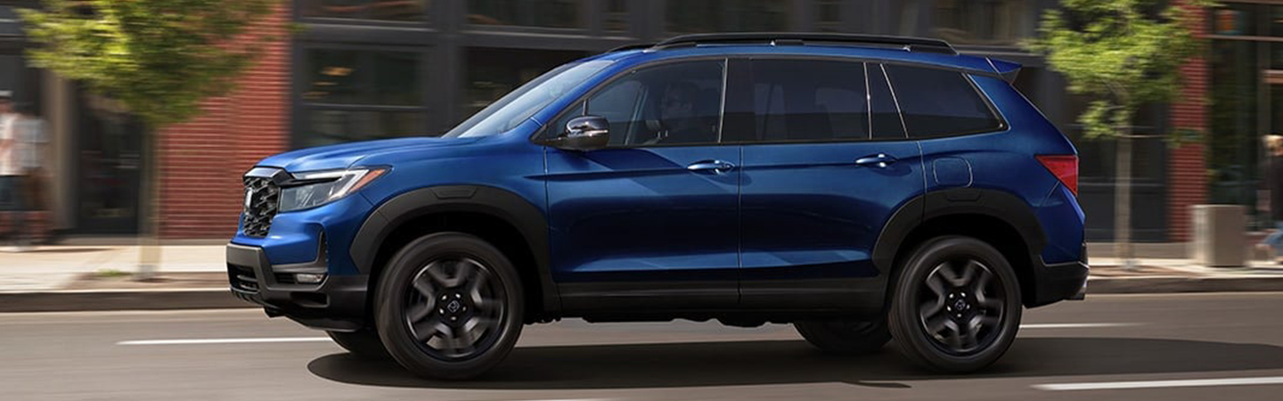 2024 Honda Passport Specs side front in blue