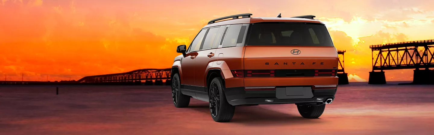 2026 Hyundai Santa Fe back view, sunset in the background