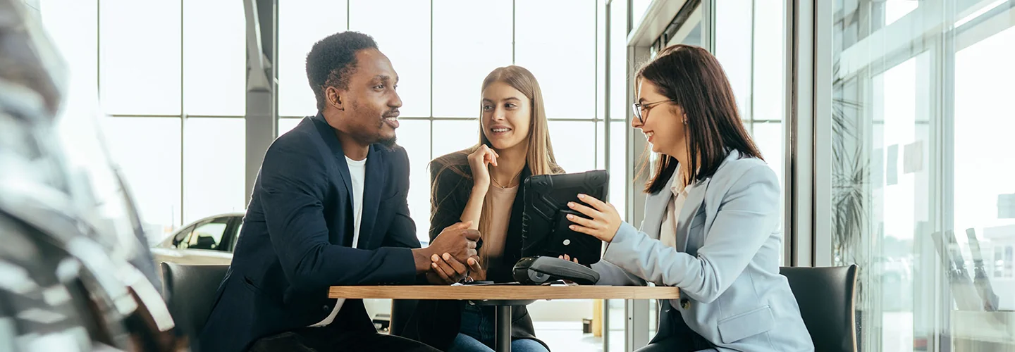 Sales person talking to customers about there new 2026 Kia Sorento
