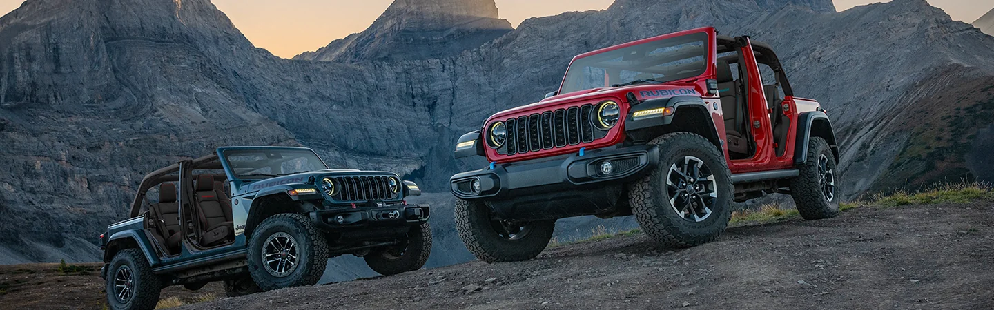a red and a blue 2026 Jeep Wrangler Sport doors off