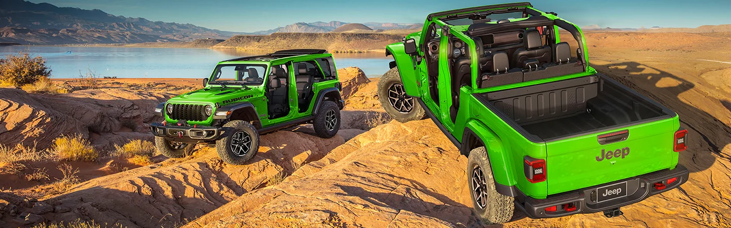 a couple of bright green 2026 Jeep Wrangler Sports