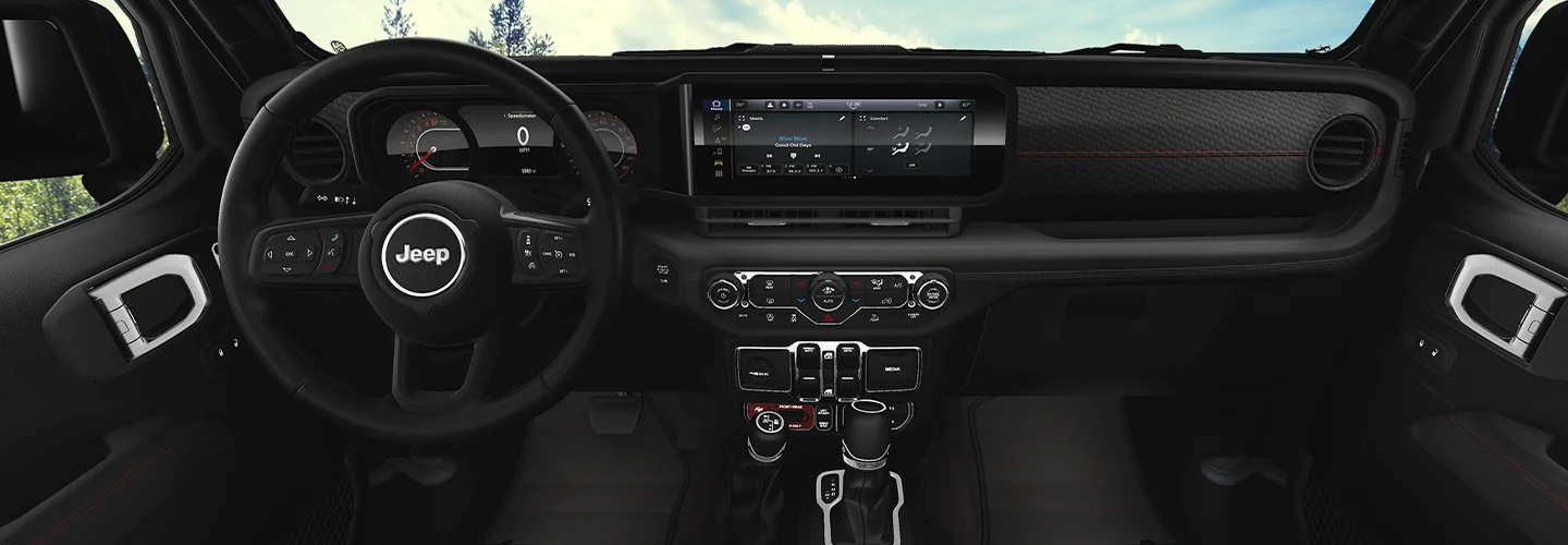 Interior view of the deashboard and tech of a 2026 Jeep Wrangler