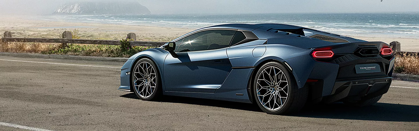 2026 Lamborghini Temerario driving on an oceanside road