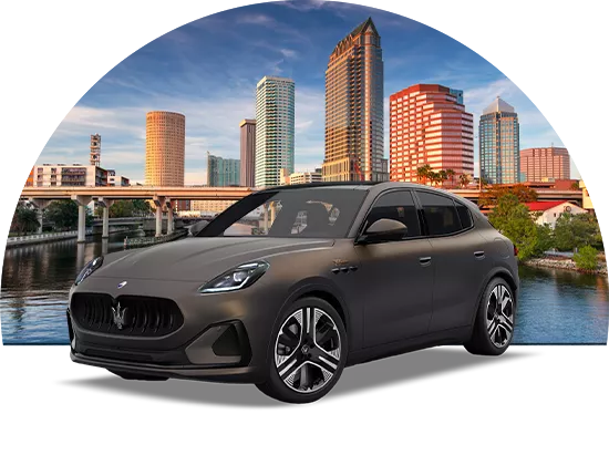 Maserati parked in fron of the Tampa skyline