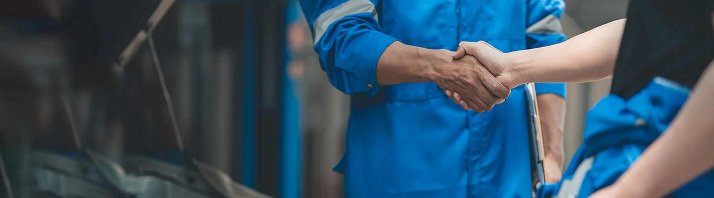 service techs shaking hands after completing repair