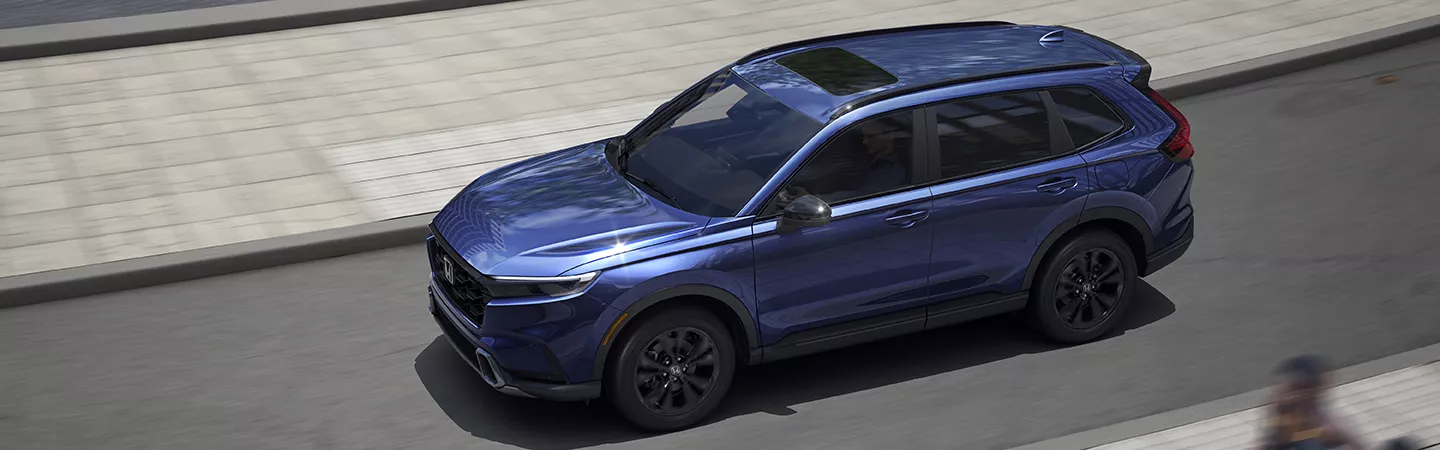 Aerial view of the 2026 Honda CR-V driving through a city