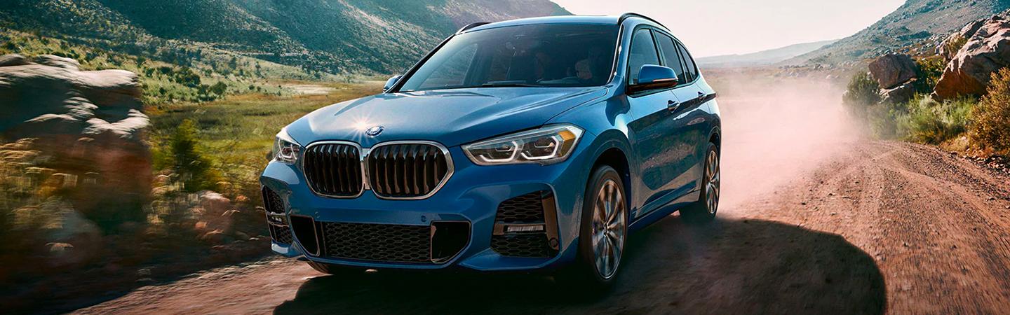 BMW X1 in motion through a trail