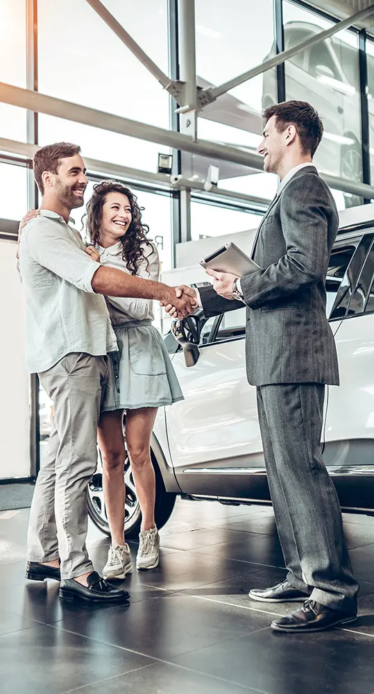 people shaking hands in car showroom in Huntsville