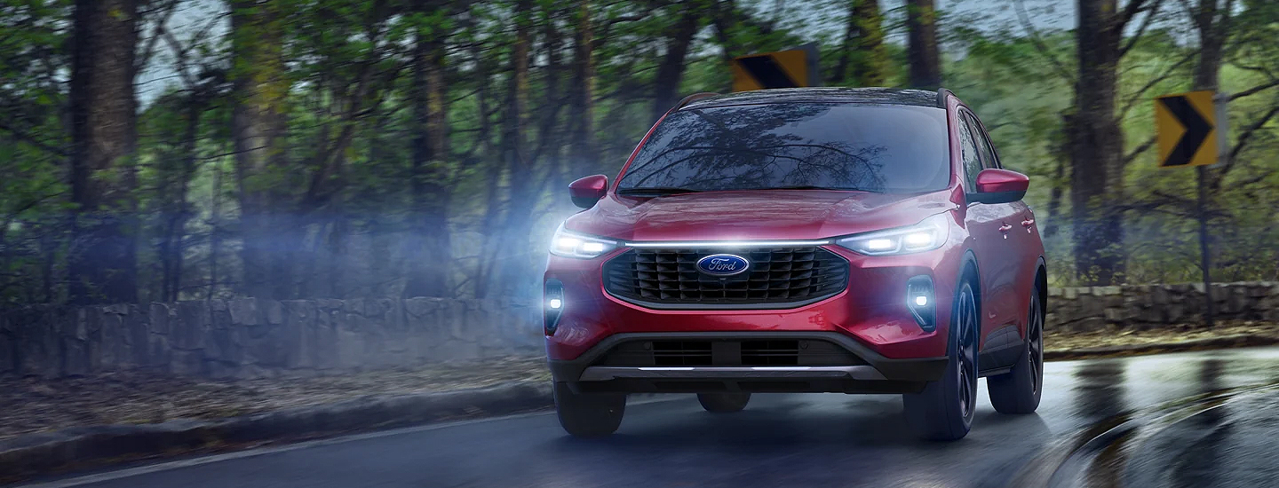2023 Ford Escape driving in the woods while raining