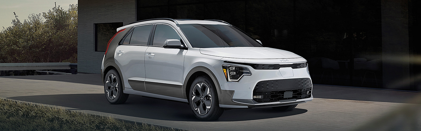 2024 Kia Niro EV vs 2024 Kia EV9 front side in white