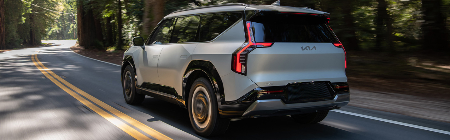 2024 Kia Niro EV vs 2024 Kia EV9  back side in blue