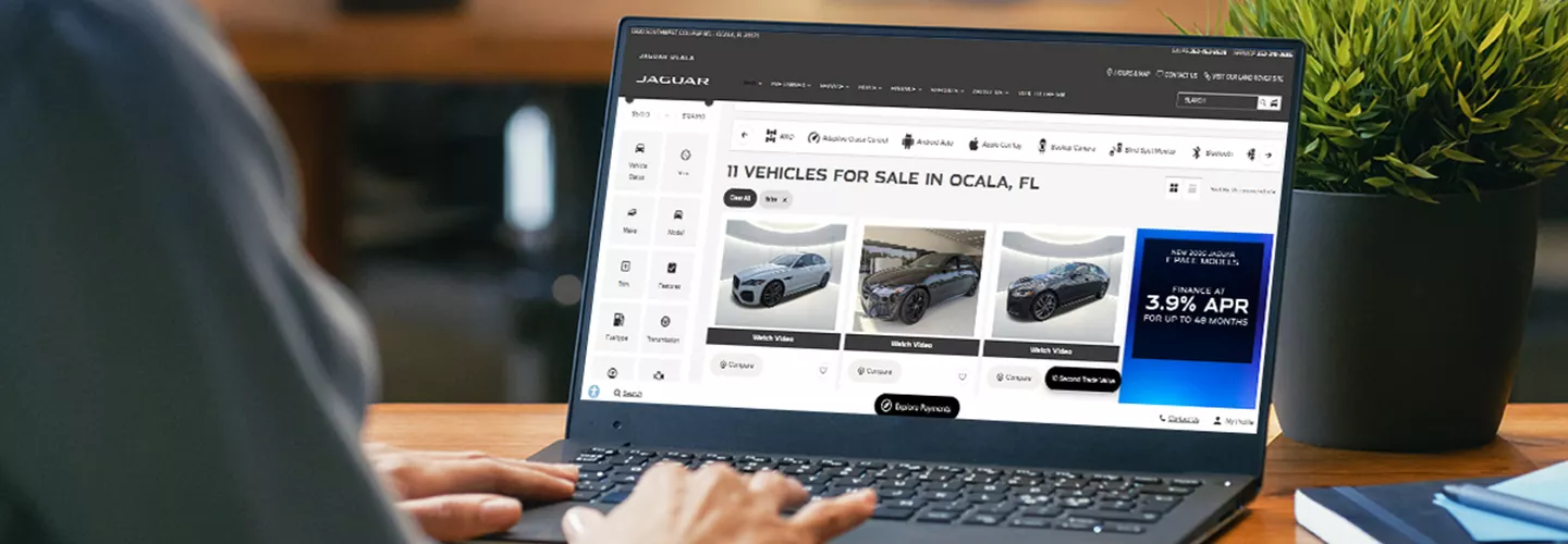Person on a laptop looking at jaguarocala.com