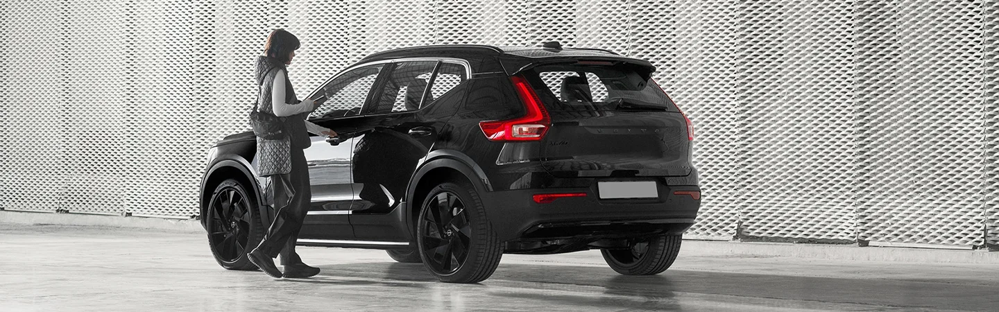 Side Back view of a black parked 2025 Volvo XC40