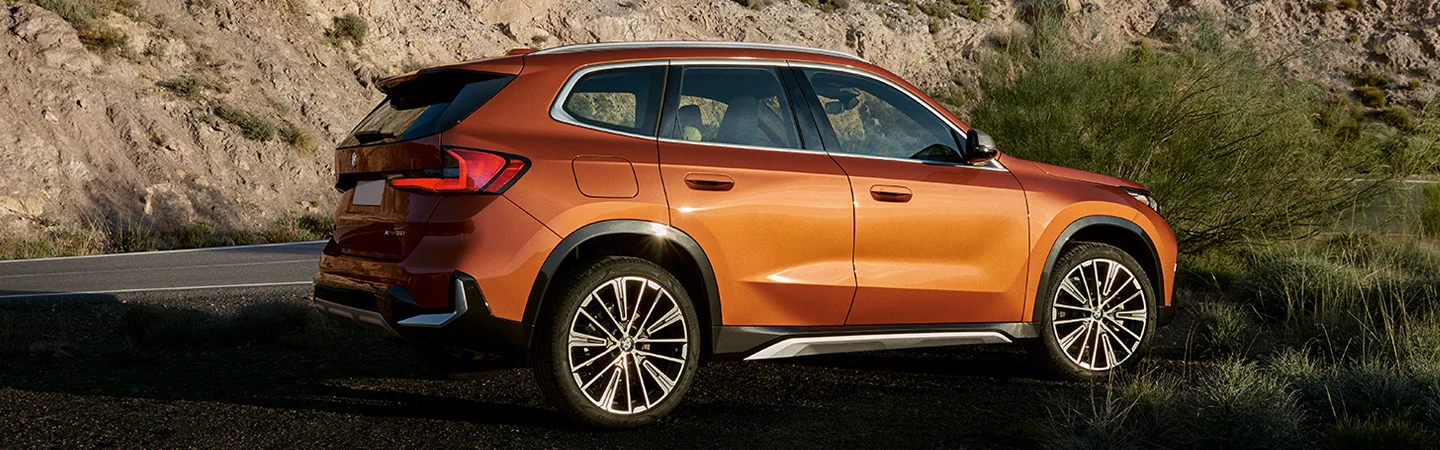 2025 BMW X1 Specs color Orange and side view