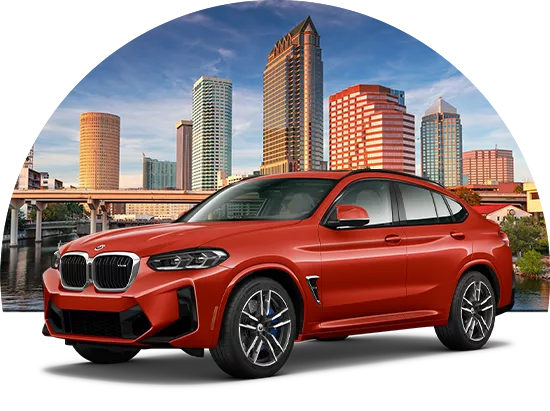 BMW parked in front of the Tampa city skyline
