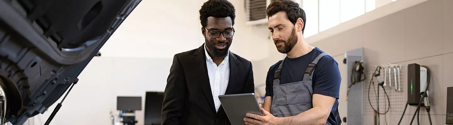 Salesperson showing a customer the features of a new INFINITI
