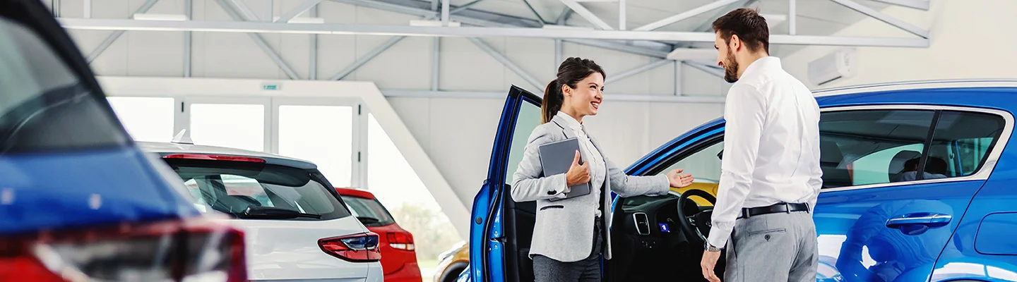 service representative showing customer to their car