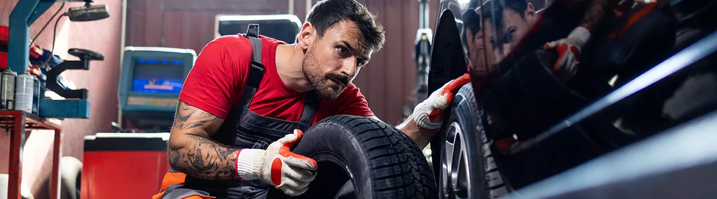 Service technician installing a tire on a Mercedes-Benz