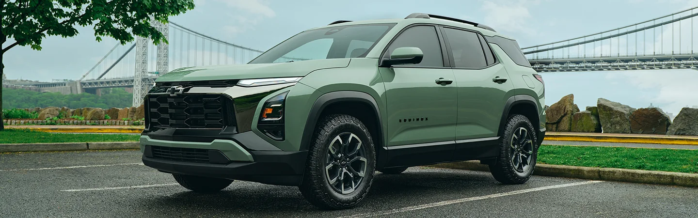 a parked green 2026 Chevrolet Equinox LT