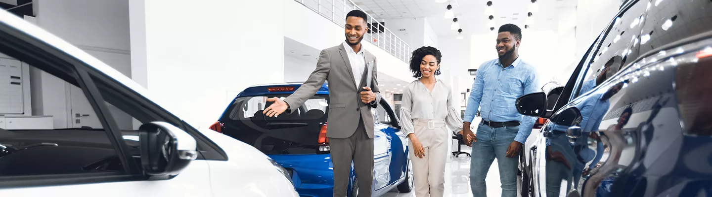man and woman walking through sales floor with a salesman