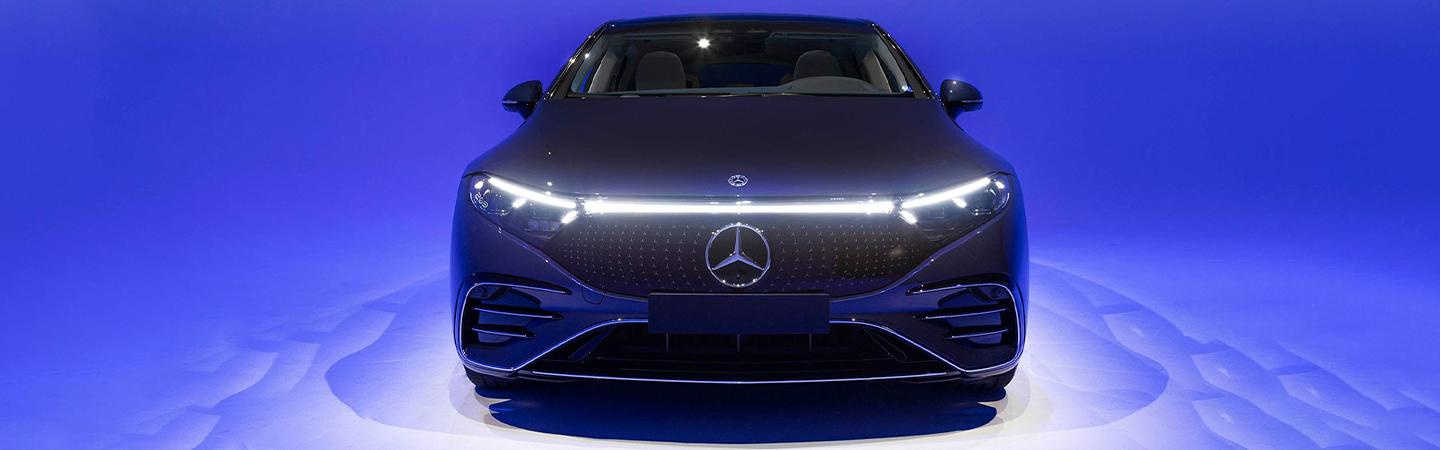 Front view of a 2022 Mercedes-Benz EQS-Class light up blue