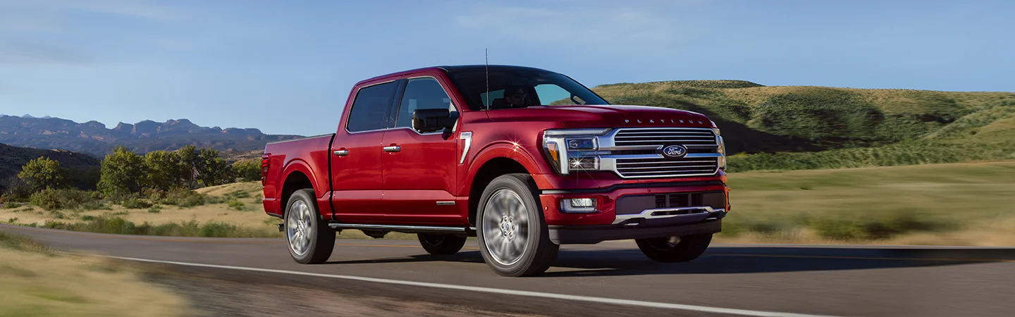 2025 Ford F-150 XL in motion on country road