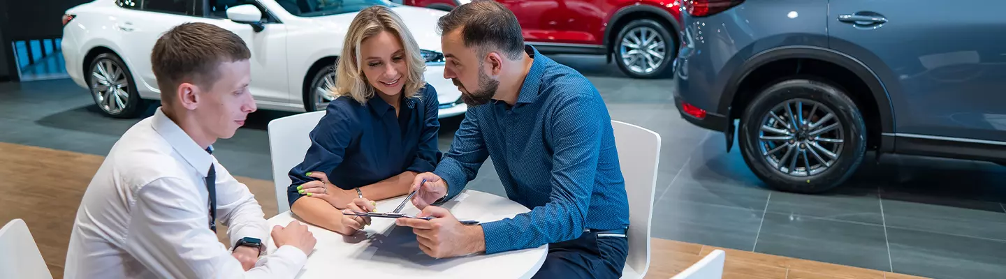 Dealer Discussing Best Hybrid Options With Customers
