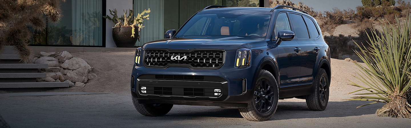 2024 Kia Telluride vs Ford Explorer front side in blue