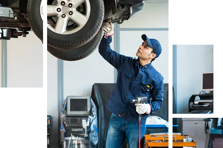 mechanic inspecting under vehicle