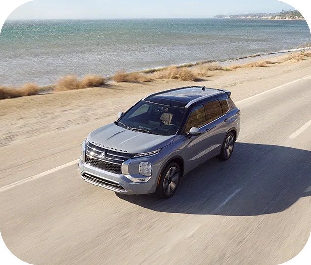 new Mitsubishi vehicle driving near beach