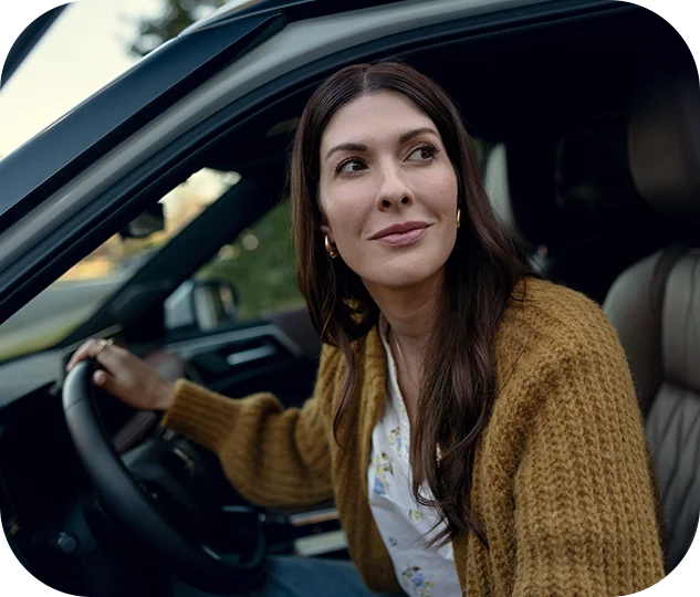 person in front seat of car