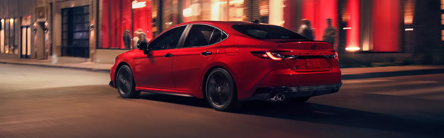 2026 Toyota Camry driving through the city at night