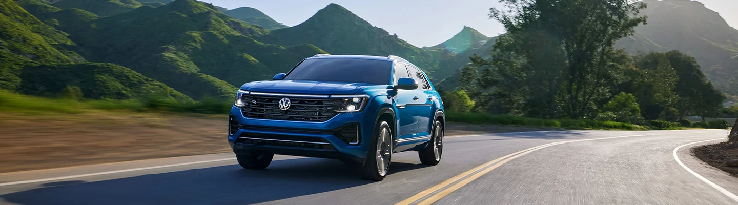 a front view os a blue Volkswagen